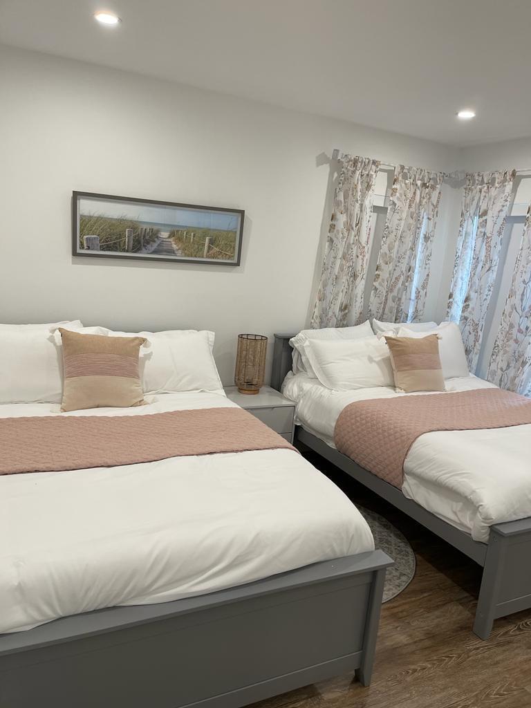 7360 San Sebastian Drive Boca Raton, FL 33433 - Photo 19 of 27 a bedroom with two beds and painting on the wall