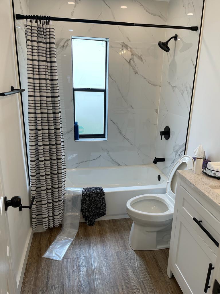7360 San Sebastian Drive Boca Raton, FL 33433 - Photo 21 of 27 a bathroom with a sink toilet and shower