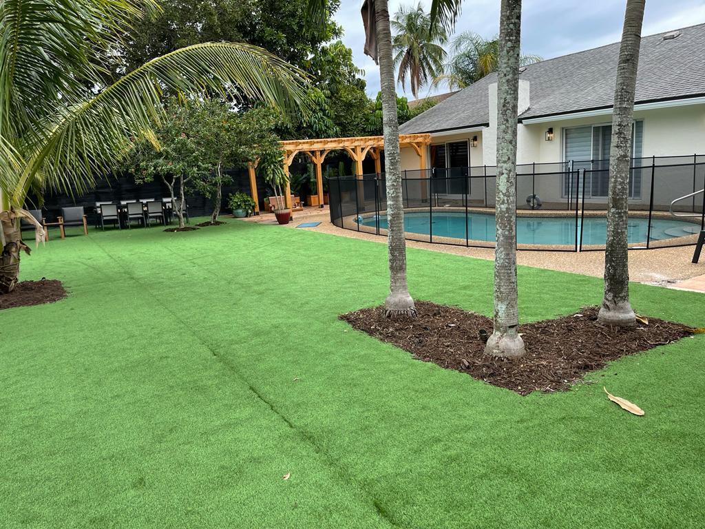 7360 San Sebastian Drive Boca Raton, FL 33433 - Photo 24 of 27 a view of a house with backyard and a tree