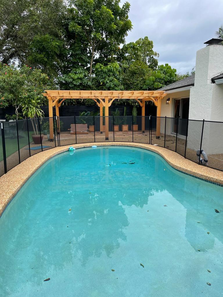 7360 San Sebastian Drive Boca Raton, FL 33433 - Photo 27 of 27 a backyard of a house with table and chairs