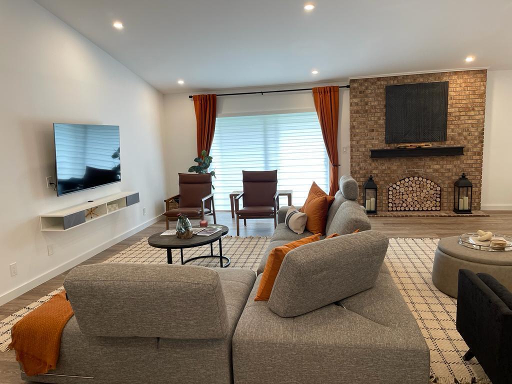 7360 San Sebastian Drive Boca Raton, FL 33433 - Photo 5 of 27 a living room with furniture and a flat screen tv