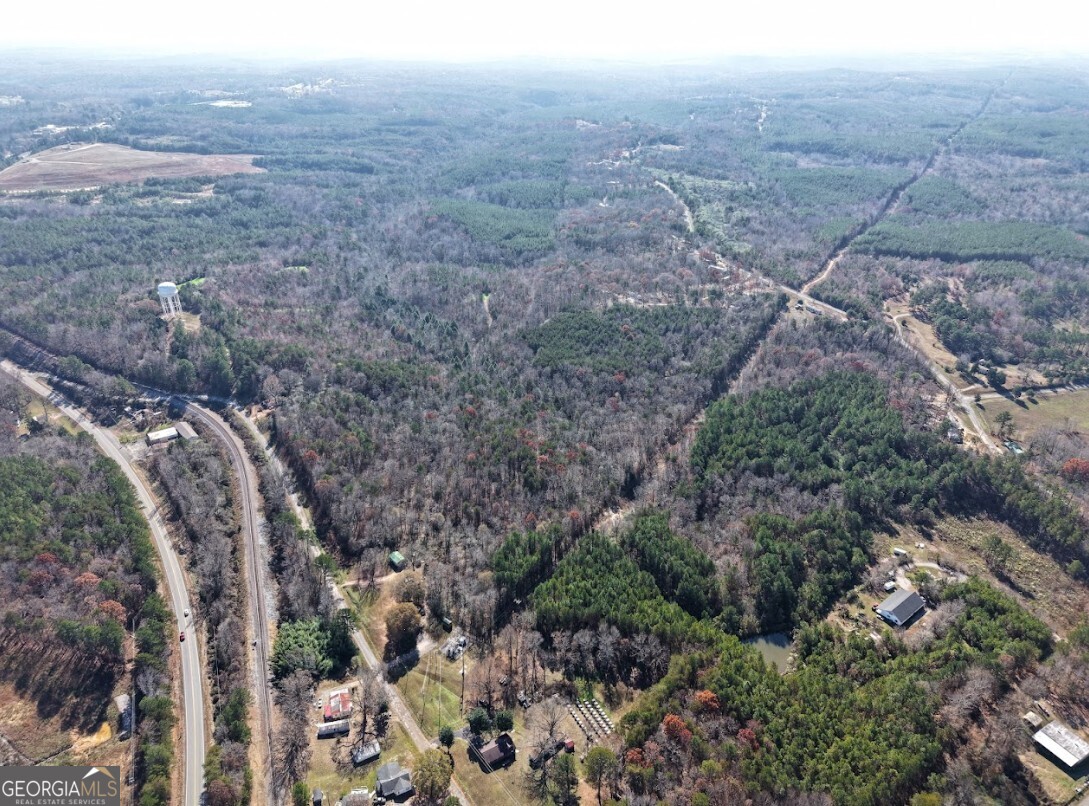 0 Sam Letson Industrial Road Haleyville, AL 35565 - Photo 11 of 28 a view of a dry yard with lots of trees