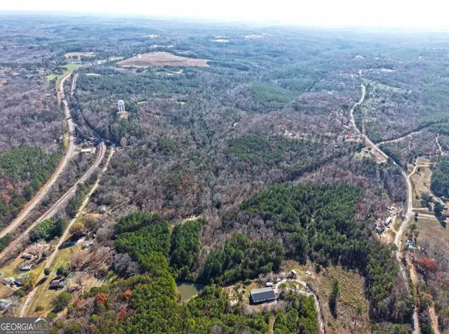an aerial view of residential house and green space