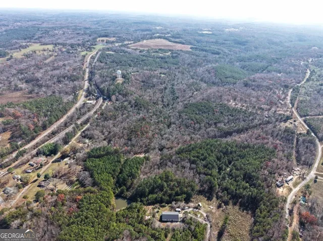 an aerial view of residential house and green space