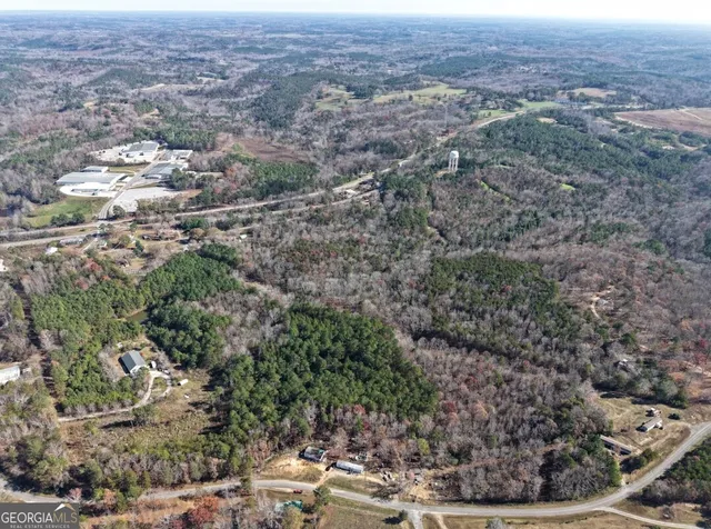 an aerial view of residential house and green space