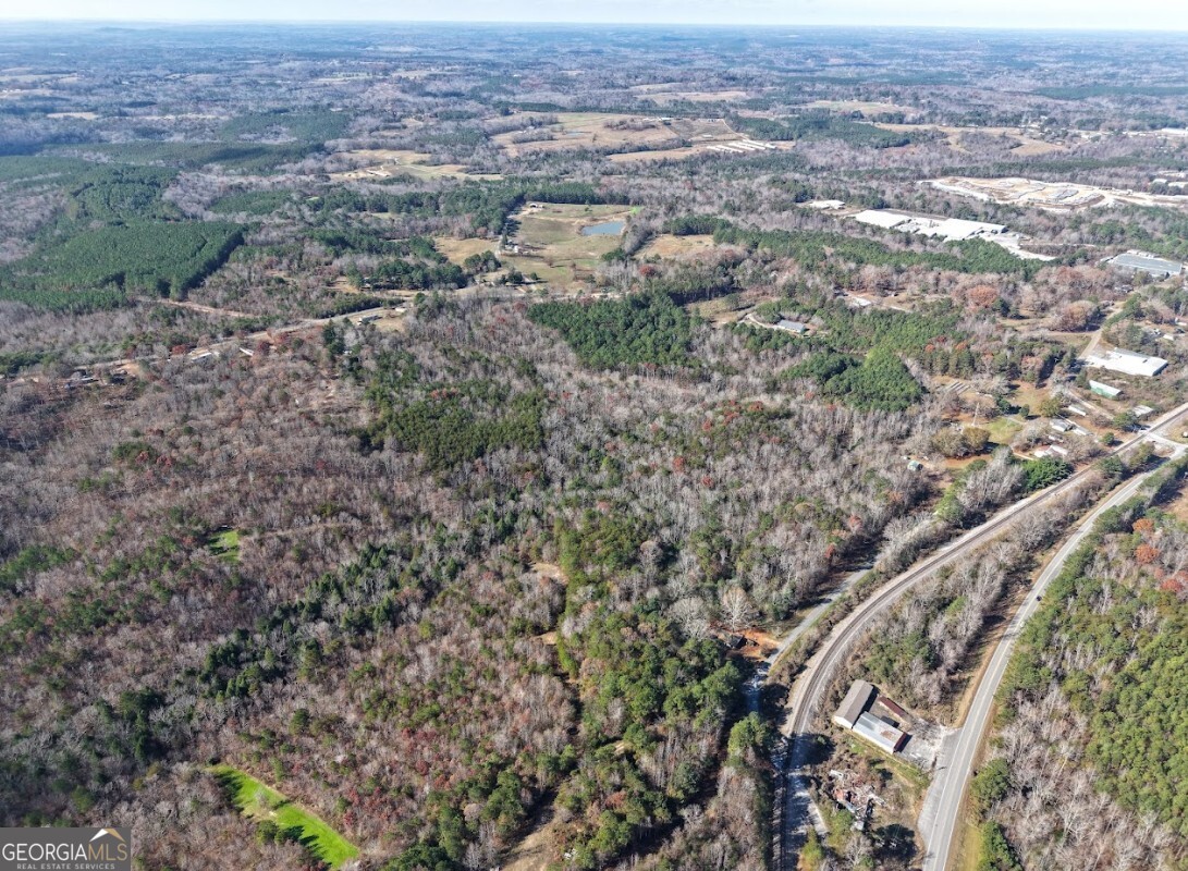 0 Sam Letson Industrial Road Haleyville, AL 35565 - Photo 21 of 28 an aerial view of residential houses with outdoor space and trees