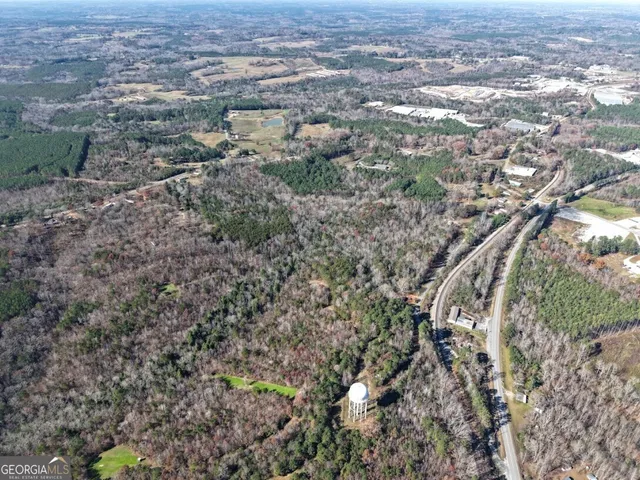 an aerial view of residential house and parking space