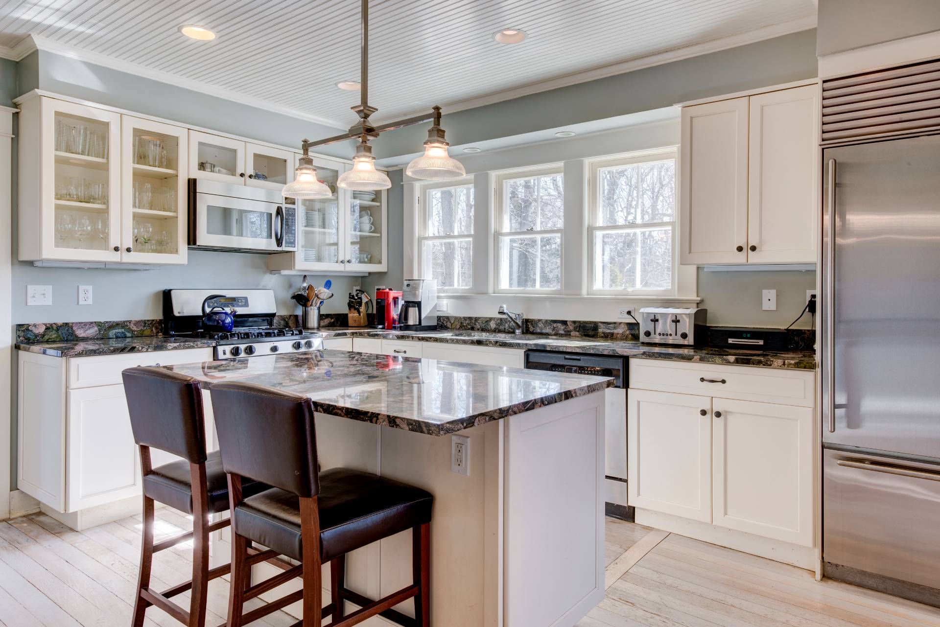 151 Church Lane Bridgehampton, NY 11932 - Photo 4 of 21 a kitchen with stainless steel appliances granite countertop a white cabinets and a stove