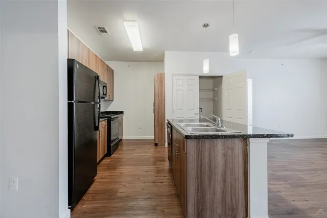 a kitchen with a stove and a microwave