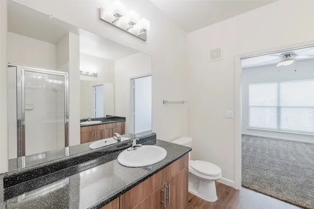 a kitchen with stainless steel appliances granite countertop a stove and a refrigerator