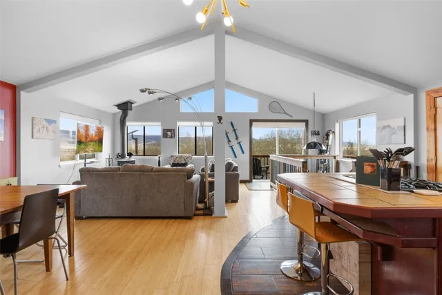 a dining room with wooden floor and breakfast area