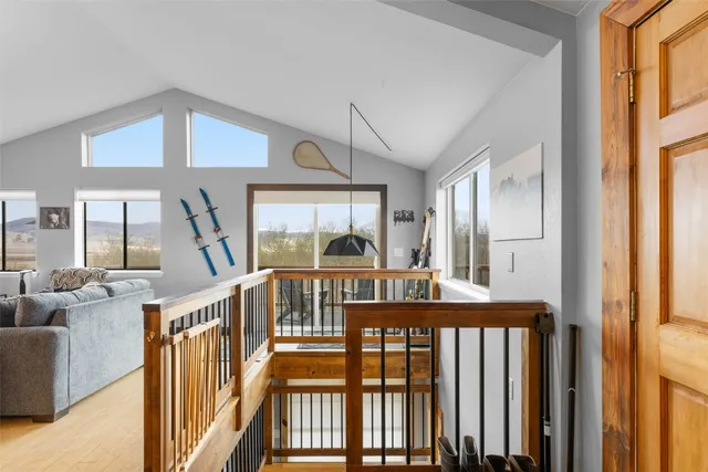 a view of a bedroom with furniture window and wooden floor