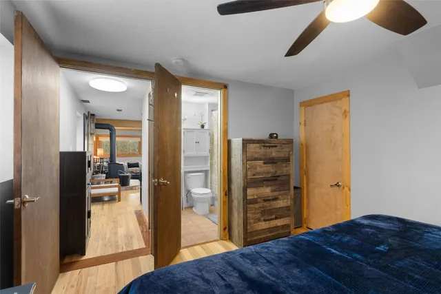 a bedroom with a bed and a view of bedroom