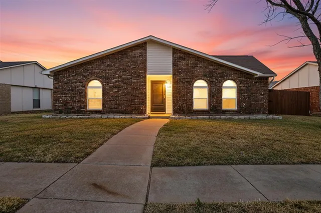 a front view of a house with yard