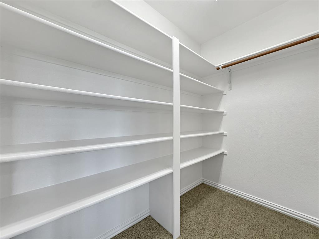 401 Varnum Way Fairview, TX 75069 - Photo 31 of 33 a view of walk in closet with empty racks