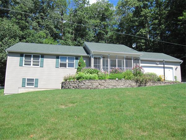 164 Brickyard Road Southampton, MA 01073 - Photo 3 of 14 front view of a house with a yard