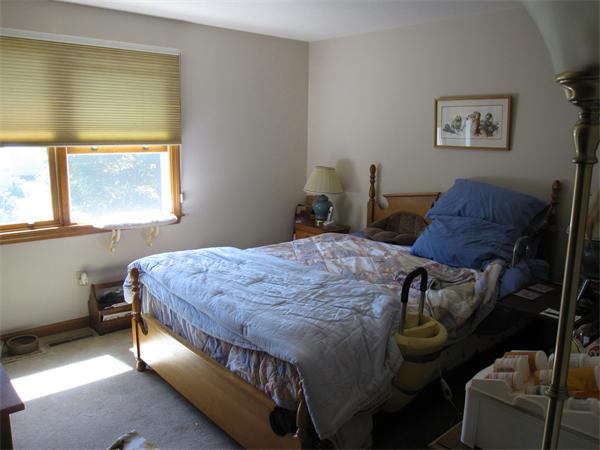 164 Brickyard Road Southampton, MA 01073 - Photo 9 of 14 a bed sitting in a bedroom next to a window