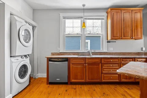 a view of a kitchen with washer and dryer