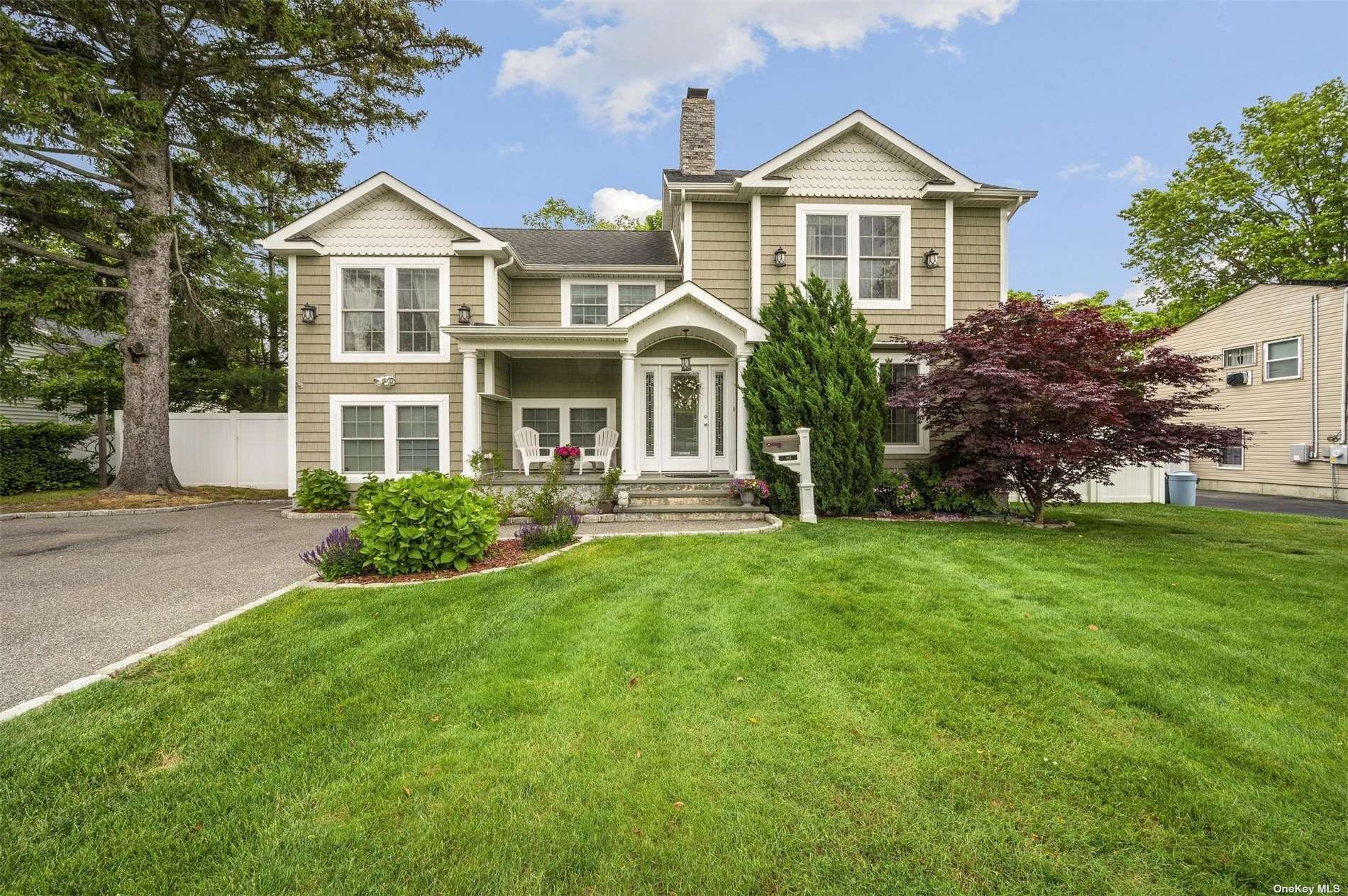 985 Manor Lane Bay Shore, NY 11706 - Photo 1 of 1 a front view of a house with a yard