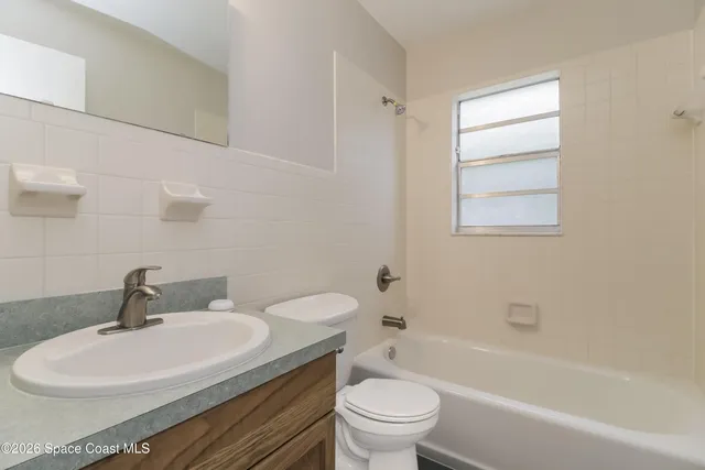 a bathroom with a sink toilet a bathtub and a shower