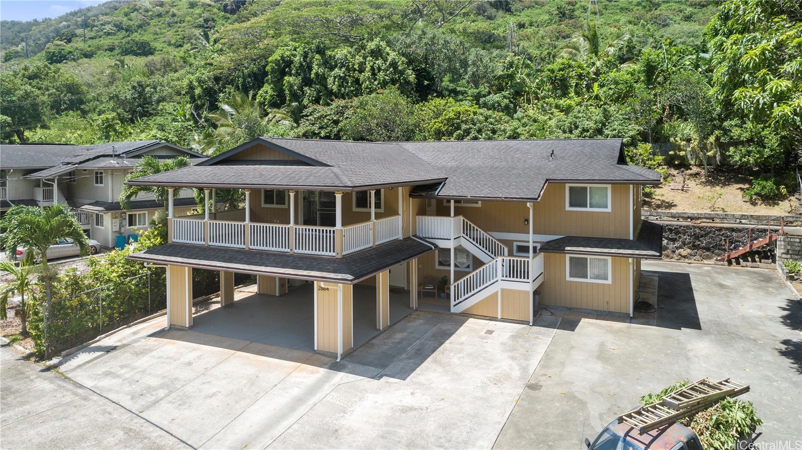 2866 Numana Road, Unit 2864 Honolulu, HI 96819 - Photo 1 of 1 a view of a house with roof deck
