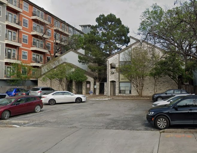 A classic brick-faced structure with a prominent entrance and convenient off-street parking.