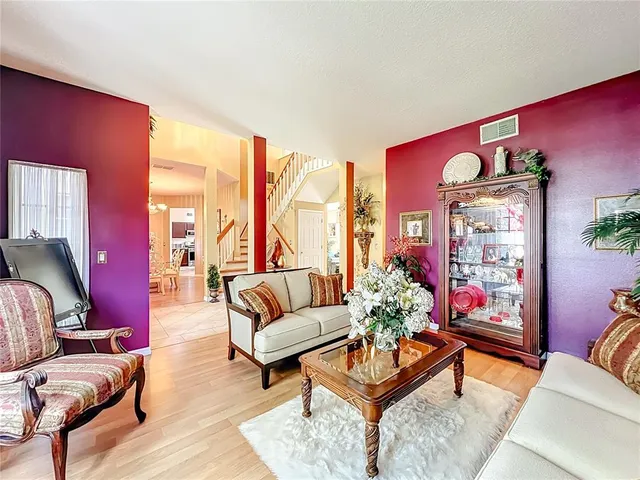 a view of a livingroom with furniture and a fireplace