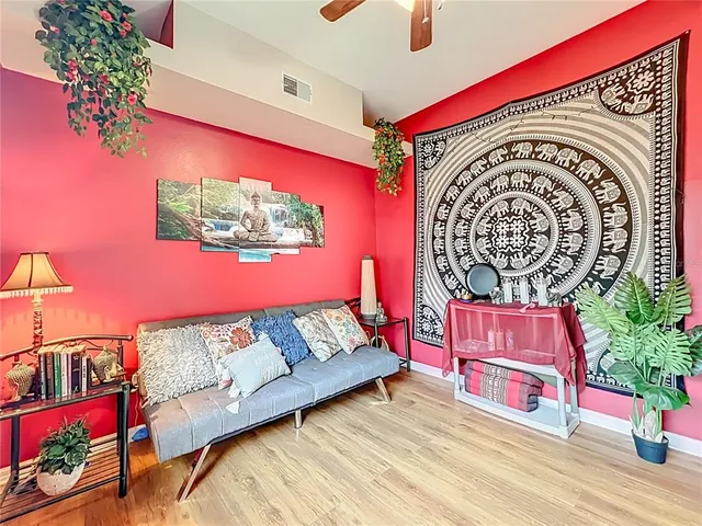 a bedroom with bed and a chandelier