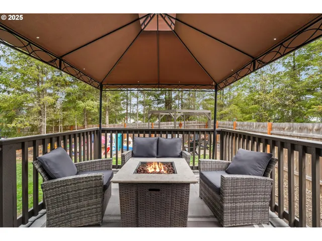 a view of a house with a yard and deck