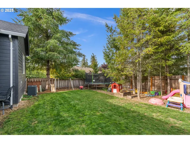 a view of a patio with a table and chairs