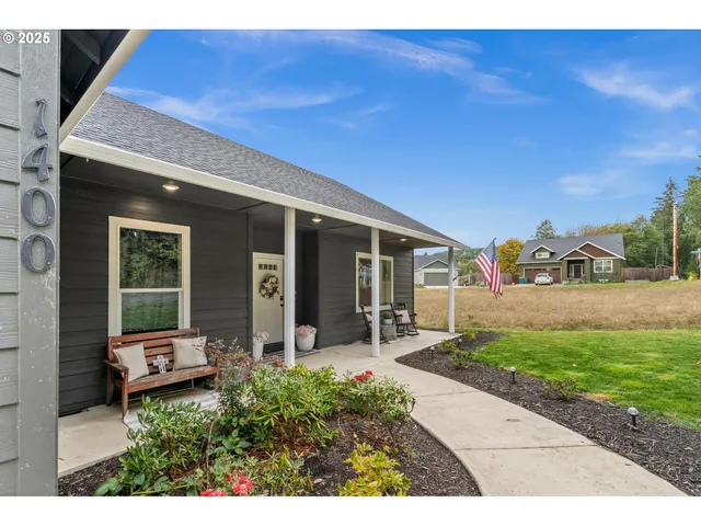 a front view of a house with garden