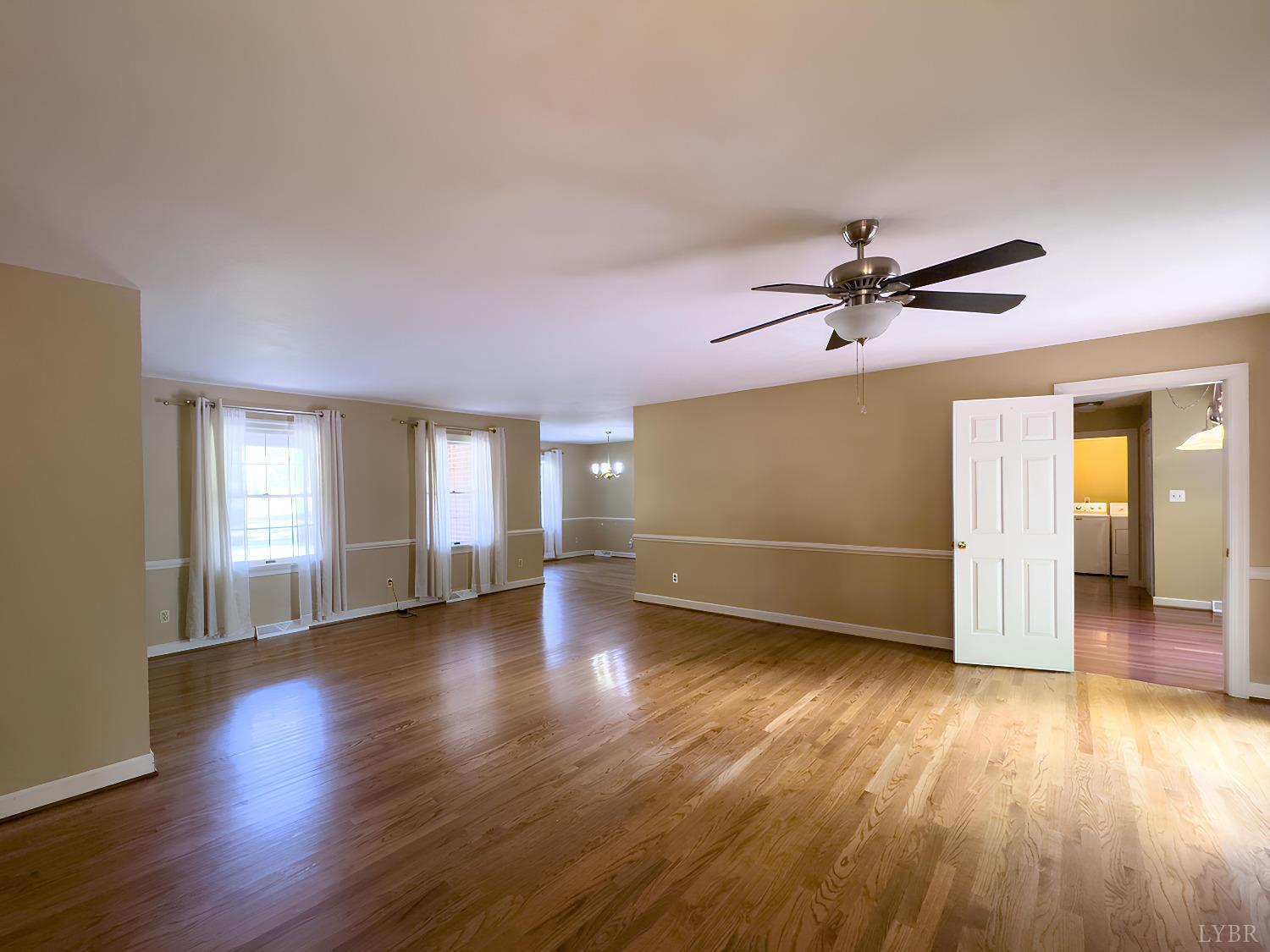 781 Lynbrook Road Rustburg, VA 24588 - Photo 4 of 47 a view of empty room with wooden floor and fan