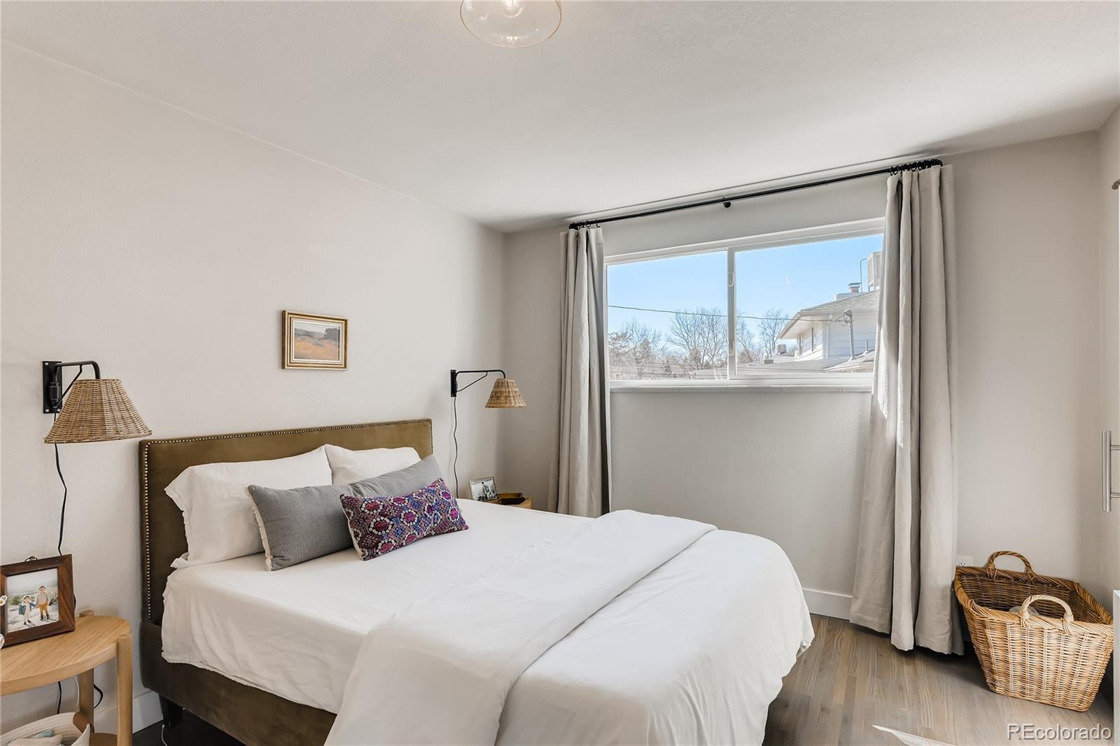 3530 East Orchard Road Centennial, CO 80121 - Photo 13 of 35 a bedroom with a bed and a window