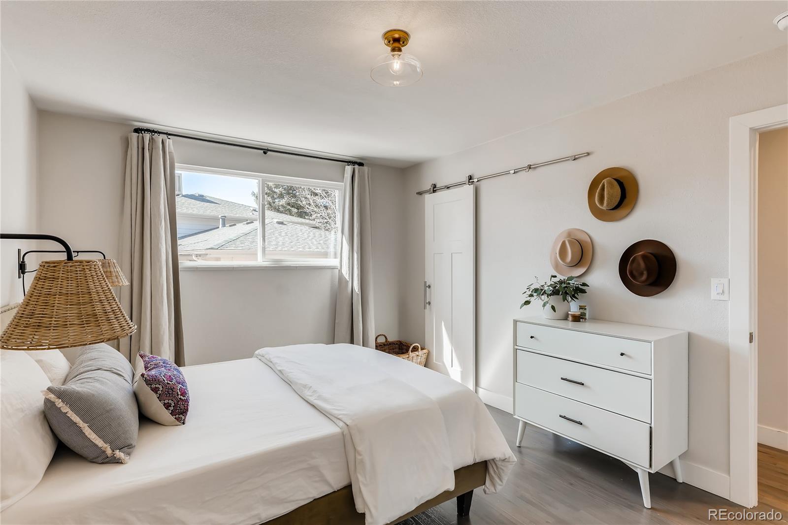 3530 East Orchard Road Centennial, CO 80121 - Photo 15 of 35 a bedroom with a bed and a window