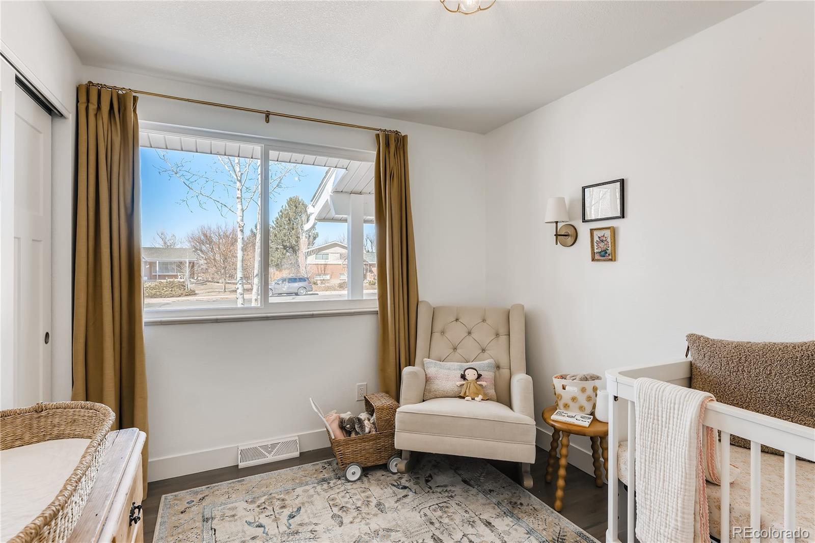 3530 East Orchard Road Centennial, CO 80121 - Photo 18 of 35 a bedroom with a bed and wooden floor