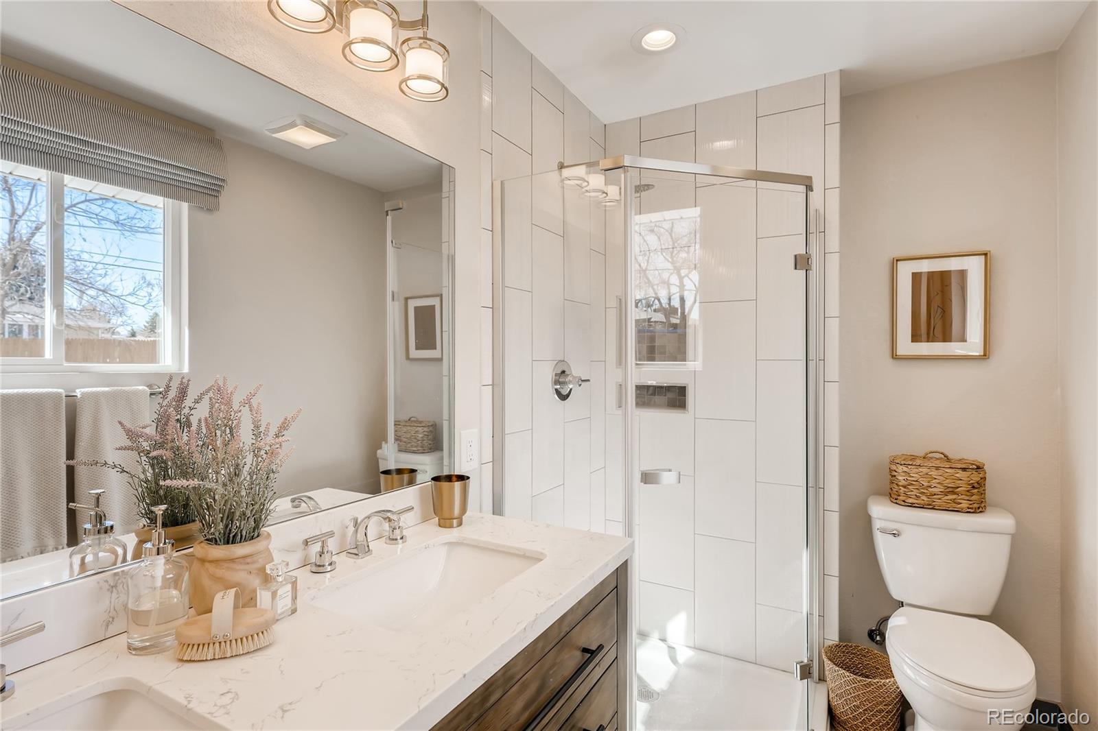 3530 East Orchard Road Centennial, CO 80121 - Photo 20 of 35 a bathroom with a sink a toilet and shower