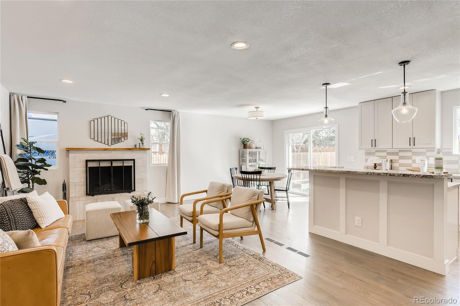 3530 East Orchard Road Centennial, CO 80121 - Photo 2 of 35 a living room with furniture and a fireplace