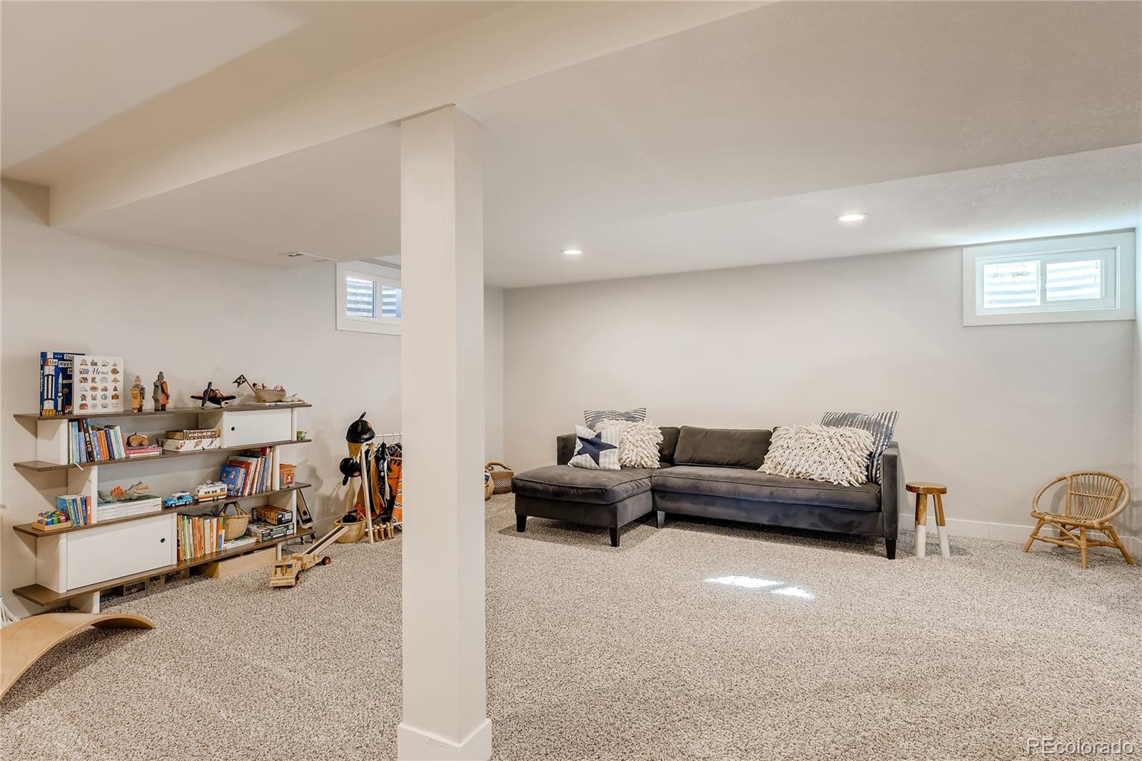 3530 East Orchard Road Centennial, CO 80121 - Photo 28 of 35 a living room with furniture and a couch
