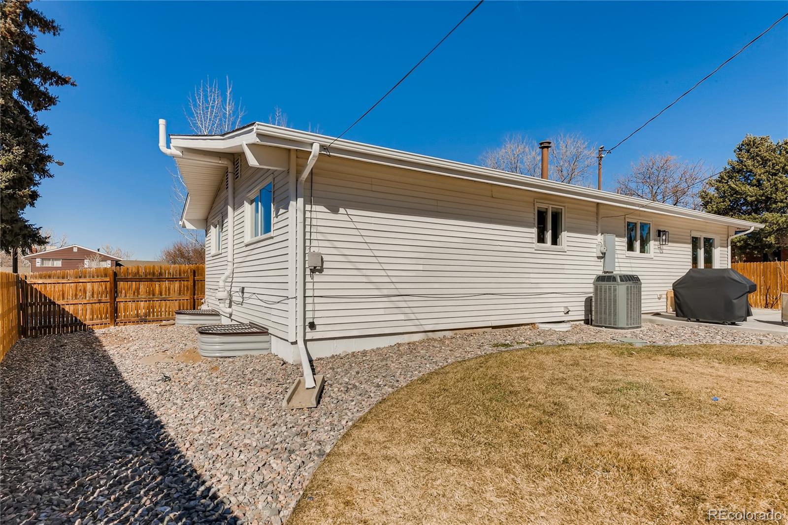 3530 East Orchard Road Centennial, CO 80121 - Photo 32 of 35 a view of a white house with wooden fence