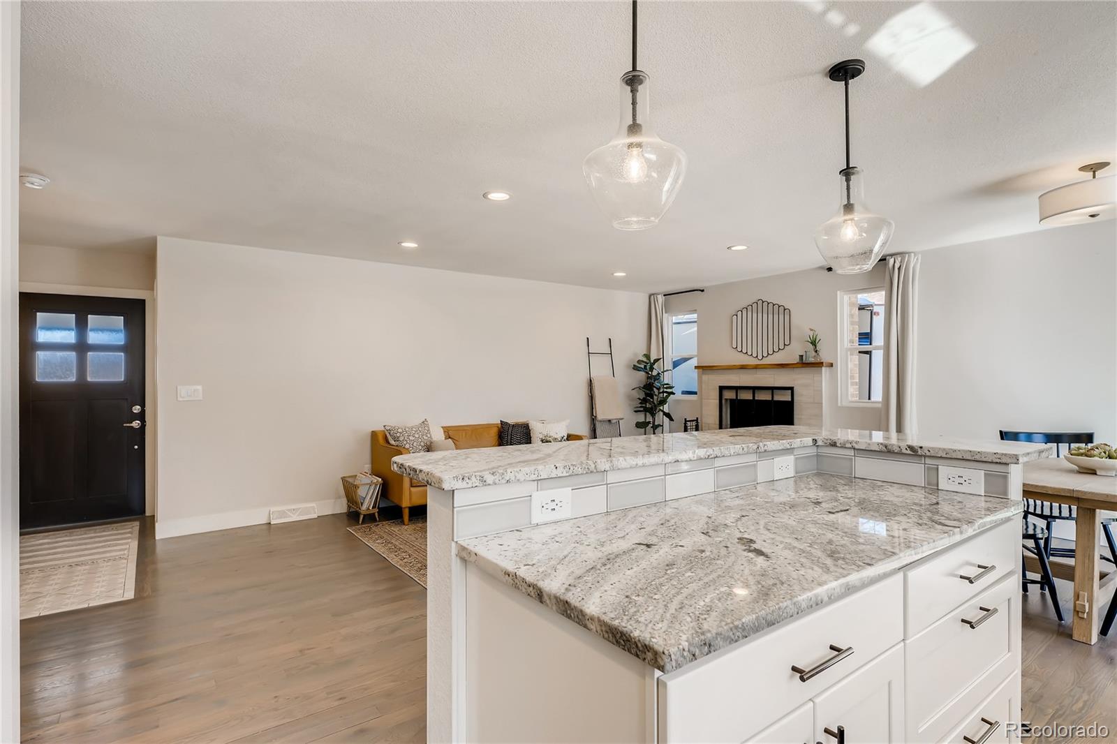 3530 East Orchard Road Centennial, CO 80121 - Photo 9 of 35 a kitchen with a stove a faucet a sink and a refrigerator