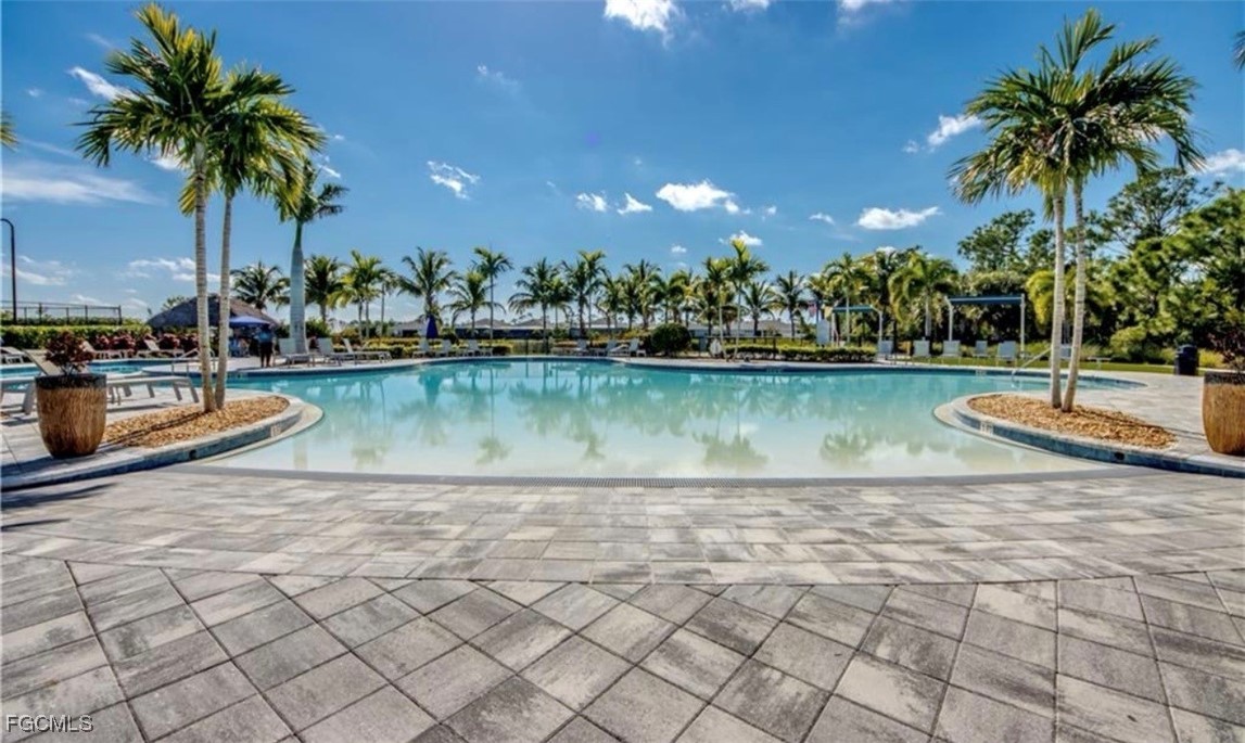 2613 Manzilla Lane Cape Coral, FL 33909 - Photo 28 of 42 a view of a swimming pool and a chairs
