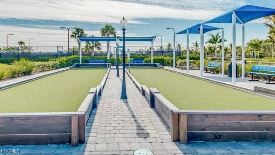 2613 Manzilla Lane Cape Coral, FL 33909 - Photo 35 of 42 a swimming pool with lawn chairs