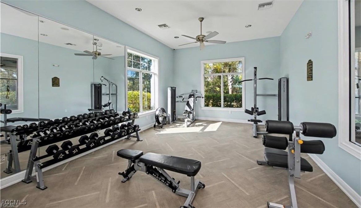 2613 Manzilla Lane Cape Coral, FL 33909 - Photo 39 of 42 a room with gym equipment and windows