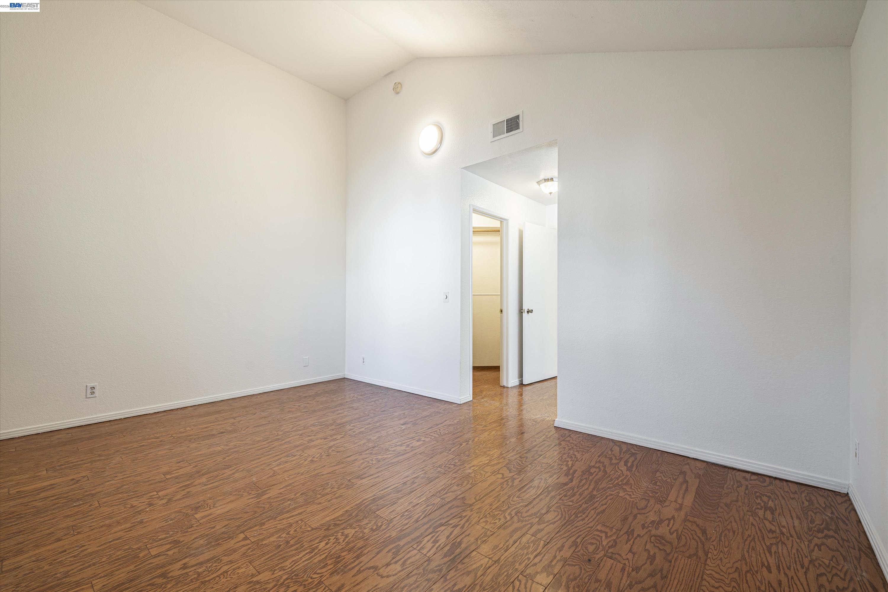 39935 Parada Street, Unit B Newark, CA 94560 - Photo 20 of 34 Vaulted ceilings, walk in closet and ensuite bathroom