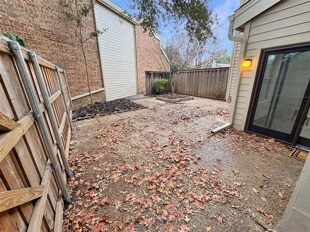 a view of a backyard of the house