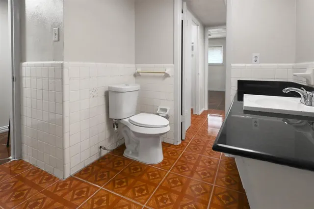 a bathroom with a sink and a toilet