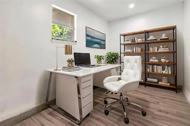 a workspace with furniture and wooden floor