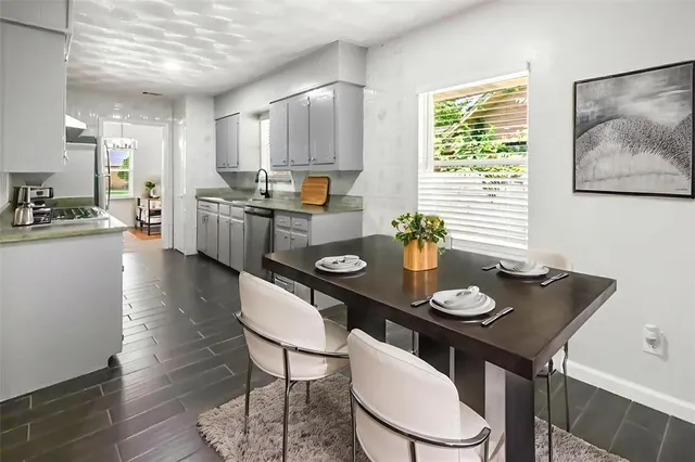 a view of a dining room with furniture and wooden floor