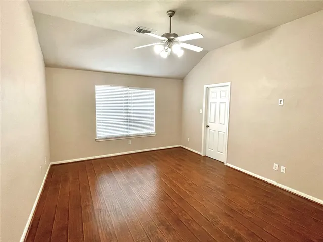 a spacious bathroom with a tub shower and sink