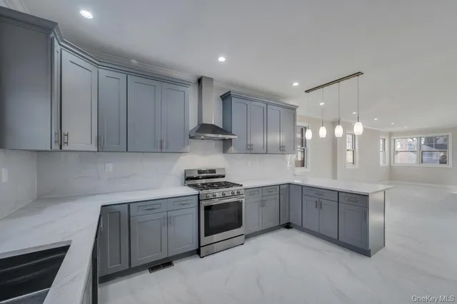 a kitchen with stainless steel appliances granite countertop a sink and cabinets